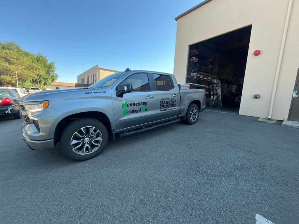 Hennessey Heating & Air service truck outside the shop
